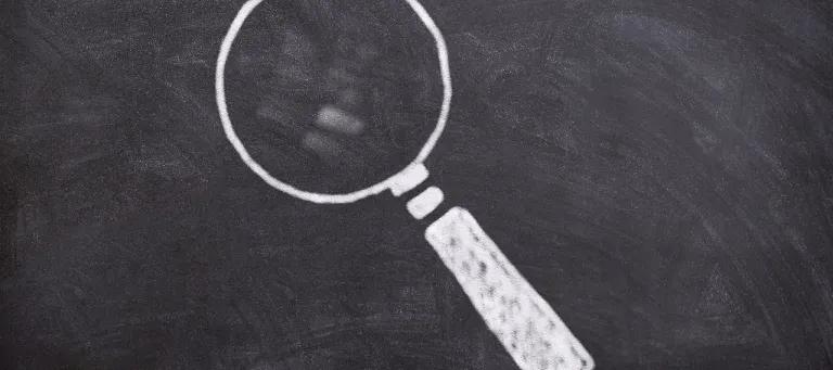 Magnifying glass indicating current research focus